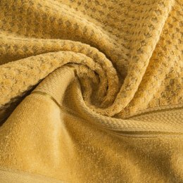 Ręcznik Jessi 30x50 musztardowy 500g/m2 z fakturą wytłaczanej krateczki i welurową bordiurą frotte Eurofirany