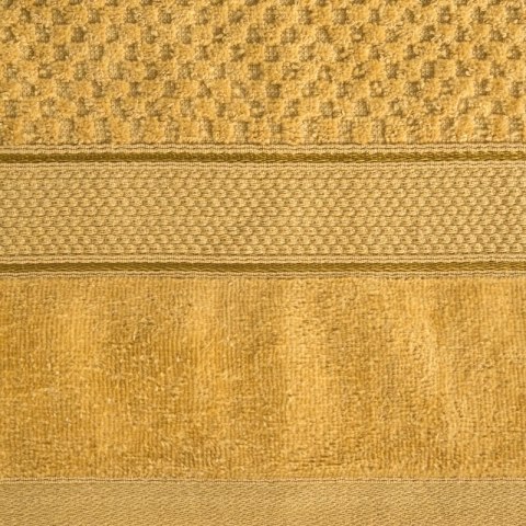 Ręcznik Jessi 90x150 musztardowy 500g/m2 z fakturą wytłaczanej krateczki i welurową bordiurą frotte Eurofirany Ręcznik Jessi 90x150 musztardowy 500g/m2 z fakturą wytłaczanej krateczki i welurową bordiurą frotte Eurofirany